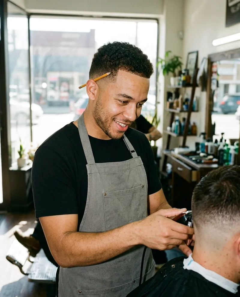 A barber mid-fade